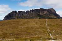 walkers approaching Cradle Mountain just before Kitchen Hut